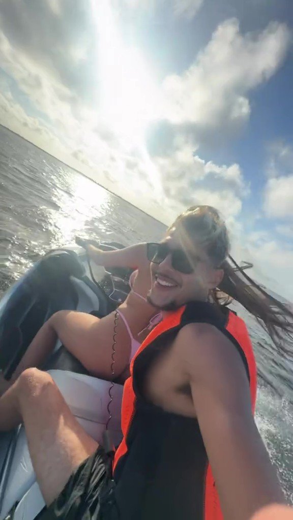 Hot brunette riding a jet ski #9geqRQhF